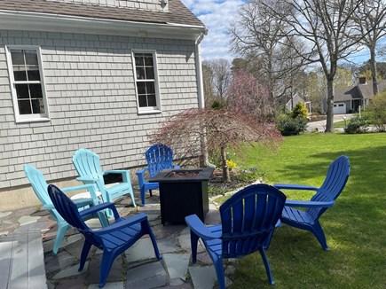 Chatham Cape Cod vacation rental - Small patio, gas firepit, 1 of 2 large flat lawn areas for games.