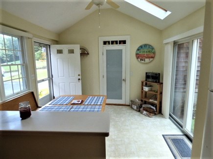 East Dennis Cape Cod vacation rental - Looking at seating area in kitchen. Door opens to the family room