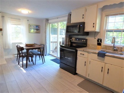 Brewster Cape Cod vacation rental - Eat in kitchen leads to back deck