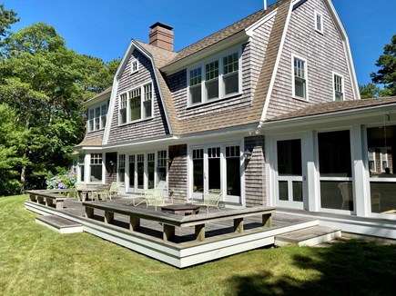 Cotuit Cape Cod vacation rental - Cape Cod Style home. Backyard looking towards water views.