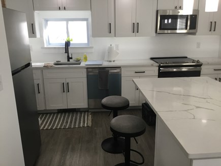 Provincetown Cape Cod vacation rental - Large quartz counter with 2 stools
