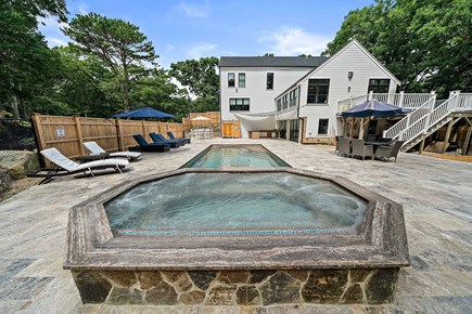 Dennis Cape Cod vacation rental - 12 person heated saltwater spillover spa overlooking pool