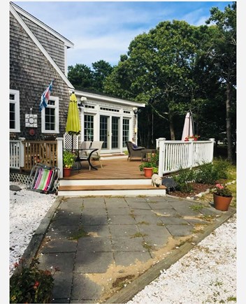 Eastham Cape Cod vacation rental - Spacious mahogany deck with several seating areas.