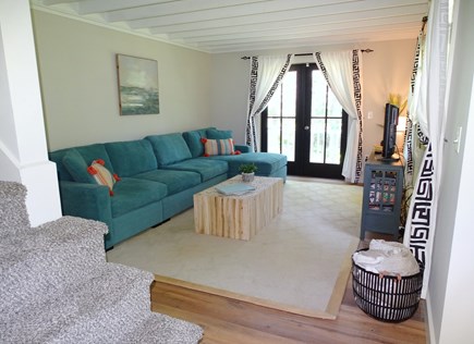 East Falmouth Cape Cod vacation rental - Living room with TV, French doors to deck