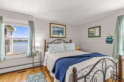 Centerville, Wequaquet Lake Waterfront Cape Cod vacation rental - Primary bedroom with queen bed and a view dreams are made of.
