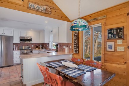 Centerville, Wequaquet Lake Waterfront Cape Cod vacation rental - Think breakfast on the dining nook - 1/2 bath tucked off kitchen.