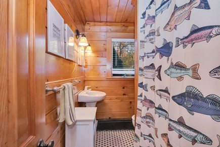 Centerville, Wequaquet Lake Waterfront Cape Cod vacation rental - Immaculate bathroom with tasteful decor & tub / shower combo.