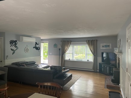 East Harwich Cape Cod vacation rental - Living room with open floor plan to kitchen and dining room