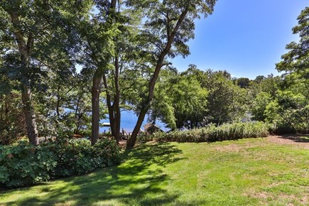 Orleans Cape Cod vacation rental - Crystal Lake viewed from patio, w/ swim dock, deck, and boathouse