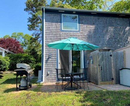 Orleans Cape Cod vacation rental - Patio with BBQ and seating for 4 next to outdoor shower