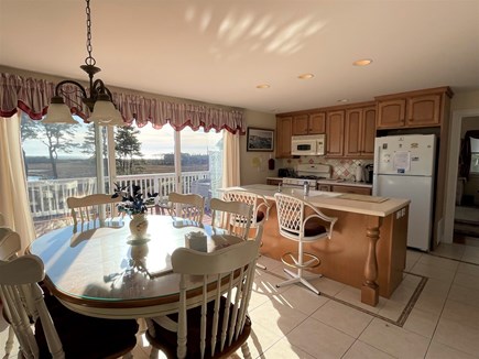 Harwich, Red River beach Cape Cod vacation rental - Kitchen with dining area and sliders to deck