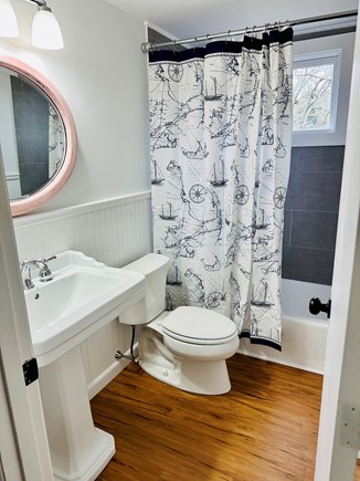 South Yarmouth  Cape Cod vacation rental - Newly renovated bathroom with bathtub and lots of closet space.