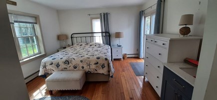 Dennis Cape Cod vacation rental - Newly painted primary bedroom with sliders to deck