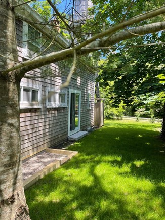 Wellfleet Cape Cod vacation rental - Sliding glass door leads to private grassy side yard