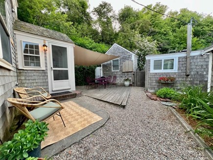 Provincetown West End Cape Cod vacation rental - Private covered patio with restored Salterini midcentury set.