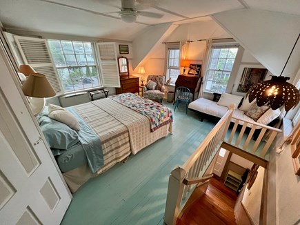 Provincetown West End Cape Cod vacation rental - Generous bed suite with bathroom and desk for remote work.