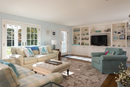 Osterville Cape Cod vacation rental - Living room with TV &  comfortable seating looking out to patio
