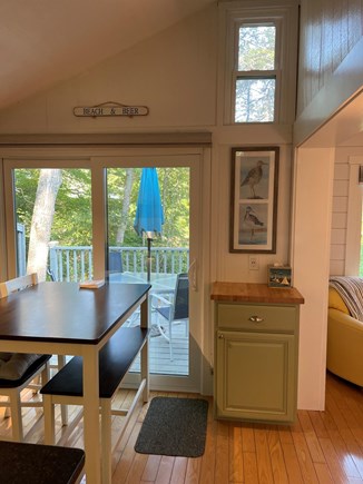 Mashpee Cape Cod vacation rental - Kitchen table and slider leading to back deck