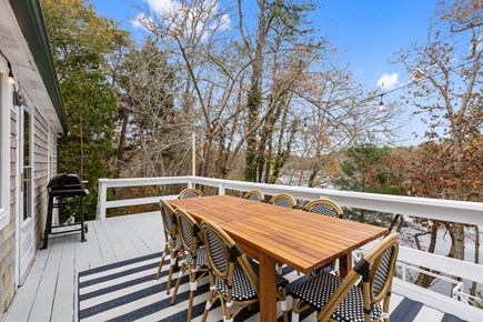 East Falmouth Cape Cod vacation rental - Deck area with outdoor dining table for 8 people along with BBQ.
