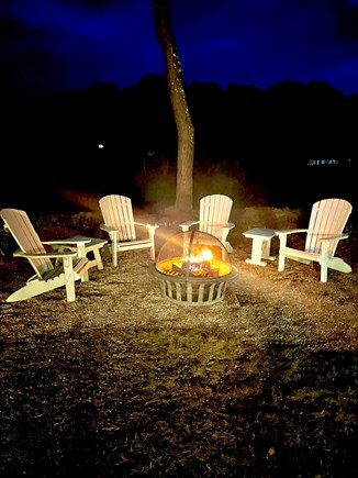 New Seabury Cape Cod vacation rental - Fire pit with Adirondack chairs overlooking golf course