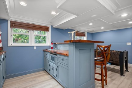 Harwich Cape Cod vacation rental - View of countertop, storage and microwave in the bonus kitchen
