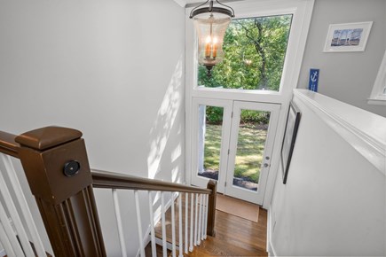 Harwich Cape Cod vacation rental - Ascend the stairs, past the formal entry door of the home, to the upper level