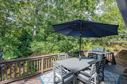 Harwich Cape Cod vacation rental - Dining area on deck provides a gas grill and dining table with seating for six