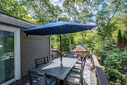 Harwich Cape Cod vacation rental - View from dining area to lounge area on lower level of deck