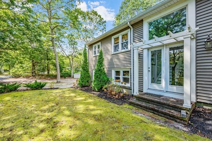 Harwich Cape Cod vacation rental - Exterior view of formal entry and driveway beyond