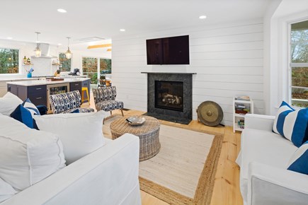 Eastham Cape Cod vacation rental - Spacious living room with fireplace & mounted t.v.
