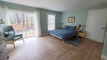 Wellfleet Cape Cod vacation rental - First floor bedroom with queen, slider and ensuite bathroom