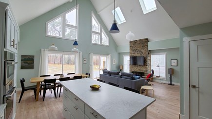 Wellfleet Cape Cod vacation rental - Kitchen with large center island and dining area beyond