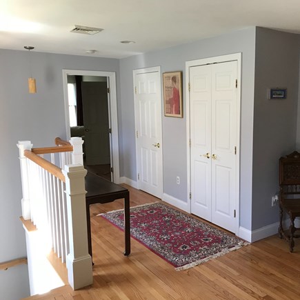 Brewster Cape Cod vacation rental - Front entry: stairs to finished basement & door to primary suite