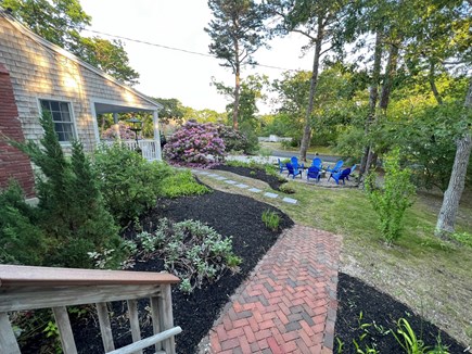Oceanside - Eastham Cape Cod vacation rental - Walkway from Deck to Firepit Area with Seating