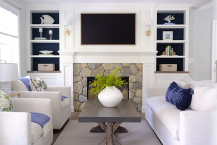 Harwich Cape Cod vacation rental - Living room with custom millwork and electric fireplace