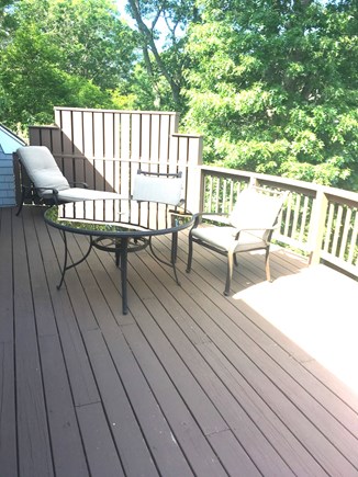 Falmouth Cape Cod vacation rental - One end of large deck off of TV room and master bedroom.
