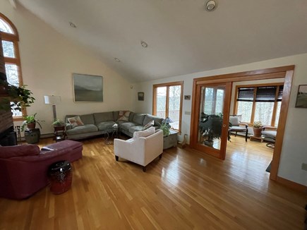 Falmouth Cape Cod vacation rental - Liv rm w/ view of front entrance landing & access to shaded deck.