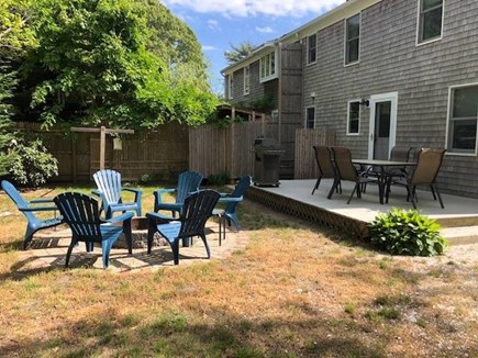 Eastham, Cape Cod Getaway  Cape Cod vacation rental - Private backyard with deck, dining, firepit, and outdoor shower.