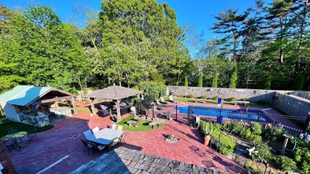Eastham, The Whole Sha-bang, POOL Cape Cod vacation rental - View of the fenced-in yard from upstairs in Oasis