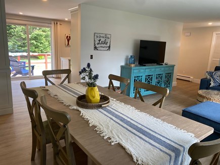 Centerville Cape Cod vacation rental - Dining table with family room with TV to the right