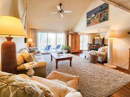 Mashpee Cape Cod vacation rental - Living room area with sliders to deck and view of the water