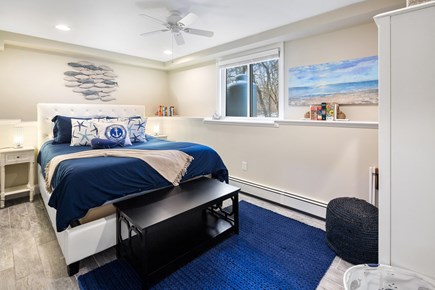 Plymouth, Ocean's Edge Oasis MA vacation rental - Queen bedroom on lower level with coastal decorations.