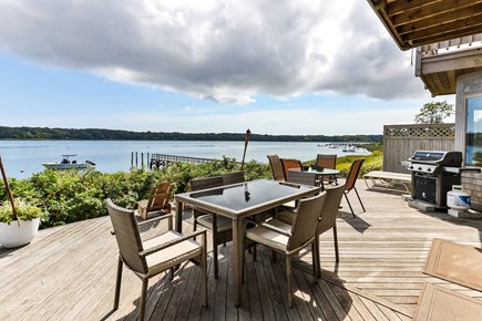 Eastham Cape Cod vacation rental - Waterfront deck with lounging and dining options