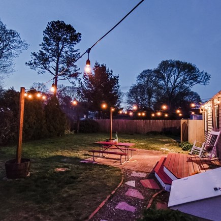 West Yarmouth Cape Cod vacation rental - Backyard with beautiful lights for evening fun outside!