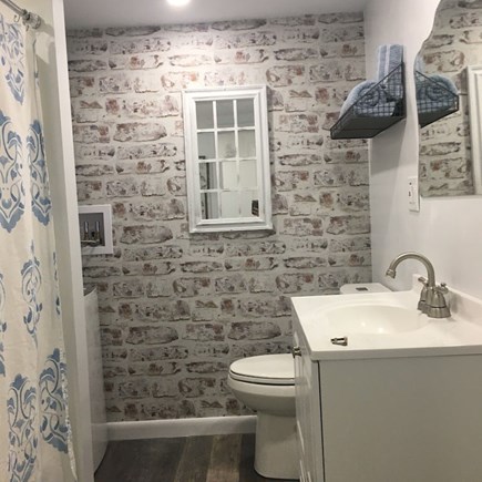 West Dennis Cape Cod vacation rental - Bathroom with tub and stacked washer/dryer