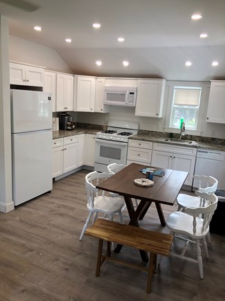 Dennis Port Cape Cod vacation rental - White cabinets, granite counters, dishwasher, Keurig and seating