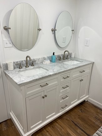 West Yarmouth Cape Cod vacation rental - New bathroom with 2 sinks, spacious white tiled shower, toilet