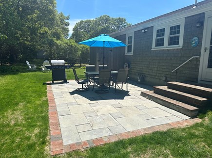Dennis Cape Cod vacation rental - Backyard equipped with outdoor shower, grill, fire pit