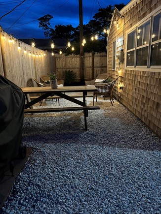 Dennis Cape Cod vacation rental - Outside guest area with grill, picnic table w/umbrella, 4 chairs