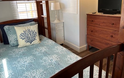 Dennis Cape Cod vacation rental - Twin bunk room has small dresser and smart TV